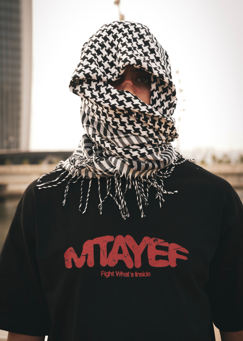 MTAYEF black oversized T-shirt with red graphic on the front
